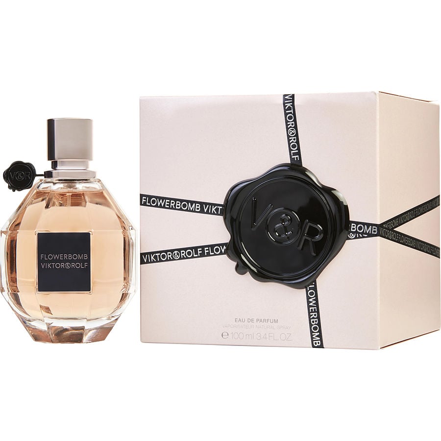 Viktor & Rolf Flowerbomb 3.4 oz EDP bottle beside wrapped gift box with black seal.
